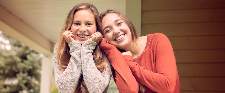 2 teen girls smiling